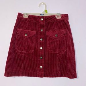 Used twice, small, A-line skirt, press buttons down the middle, maroon colored